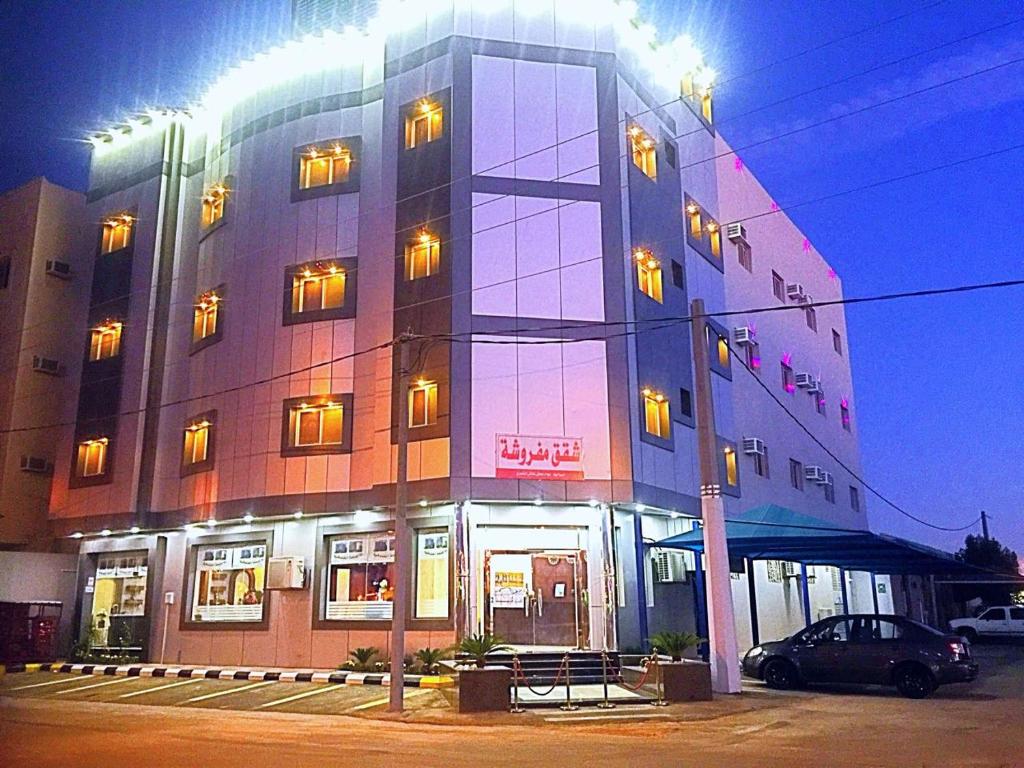 a building with a car parked in front of it at شقق الماسة التاج للوحدات السكنية in Hail