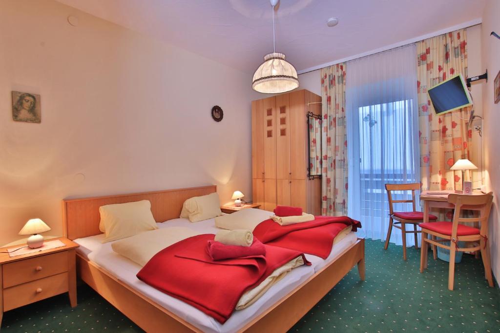 Postel nebo postele na pokoji v ubytování Hotel Beim Winkler