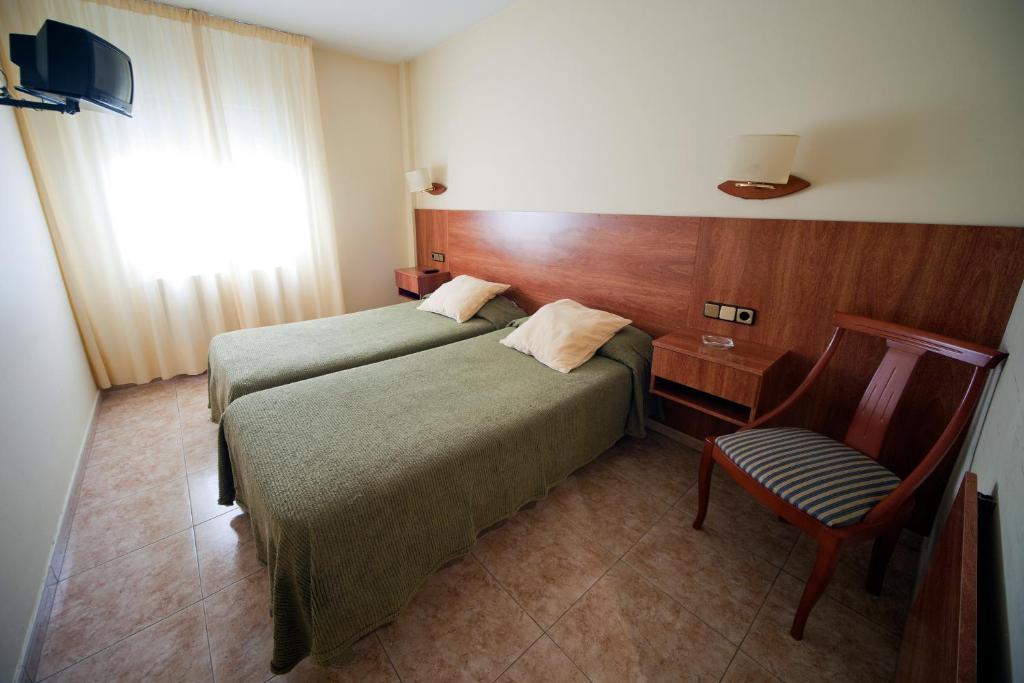 Posteľ alebo postele v izbe v ubytovaní Fonda Rita