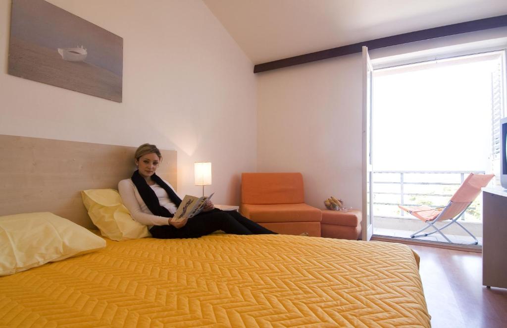 Postel nebo postele na pokoji v ubytování Hotel Borik