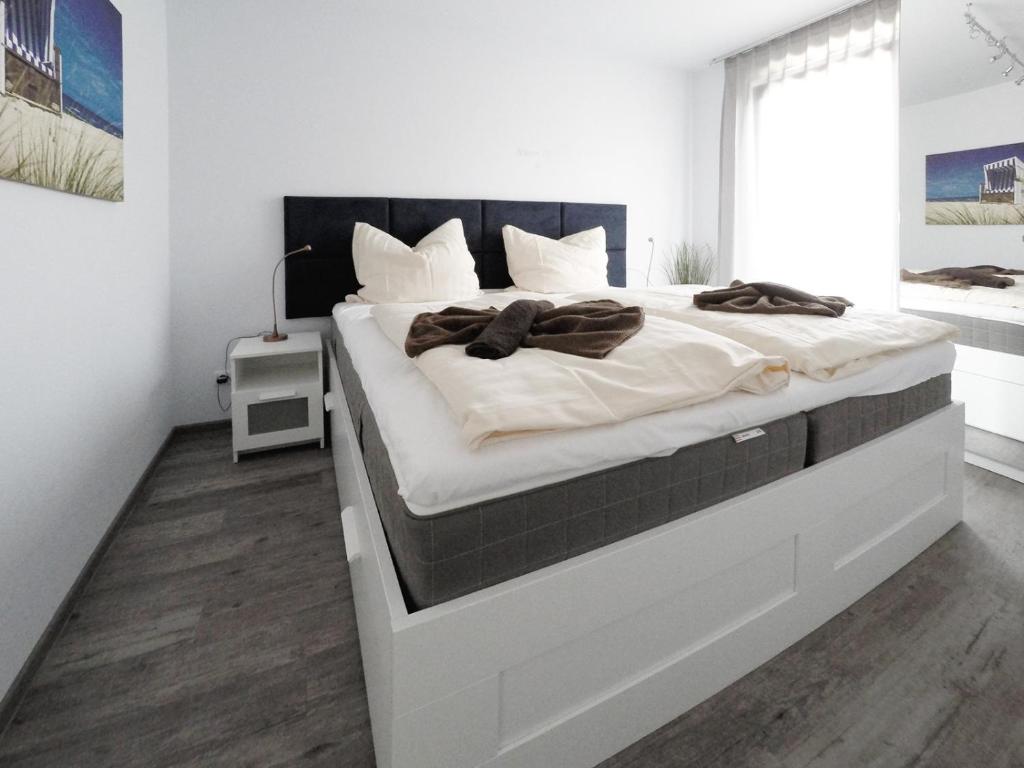 Ein Bett oder Betten in einem Zimmer der Unterkunft Ferienwohnung Toplaterne