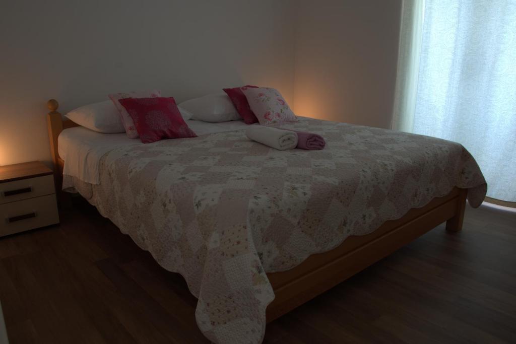 Posteľ alebo postele v izbe v ubytovaní Apartments Rogulj