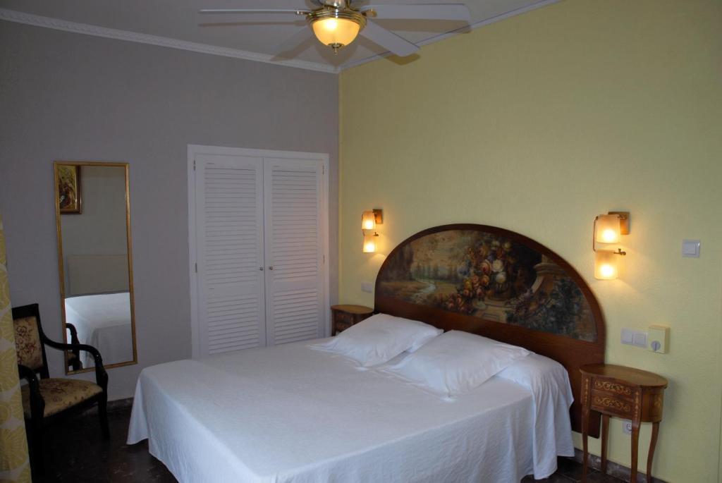 Postel nebo postele na pokoji v ubytování Hotel Grifeu