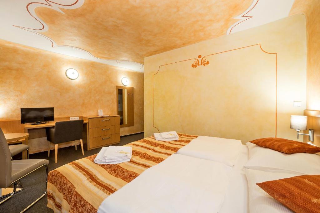 Łóżko lub łóżka w pokoju w obiekcie Pension Galko