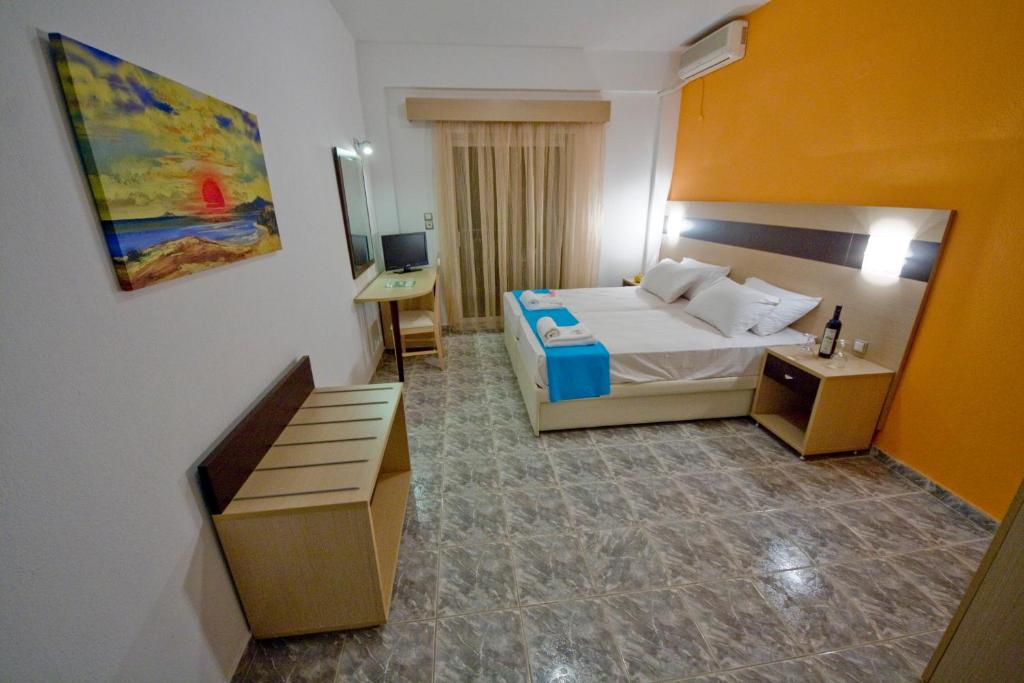 Postel nebo postele na pokoji v ubytování Akti Liakada Hotel