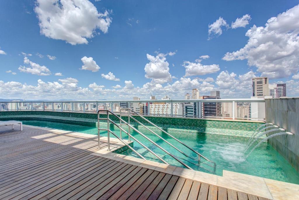 a balcony with a pool on top of a building at Be Paulista's Studios in São Paulo