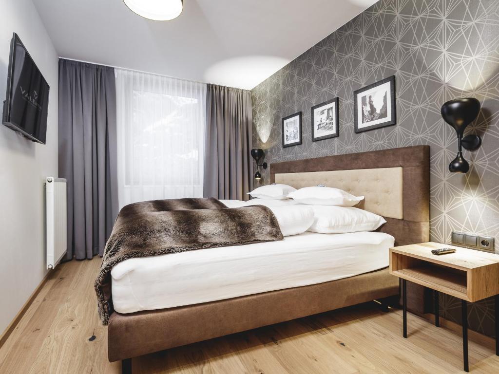 Posteľ alebo postele v izbe v ubytovaní Valentin Design Apartments