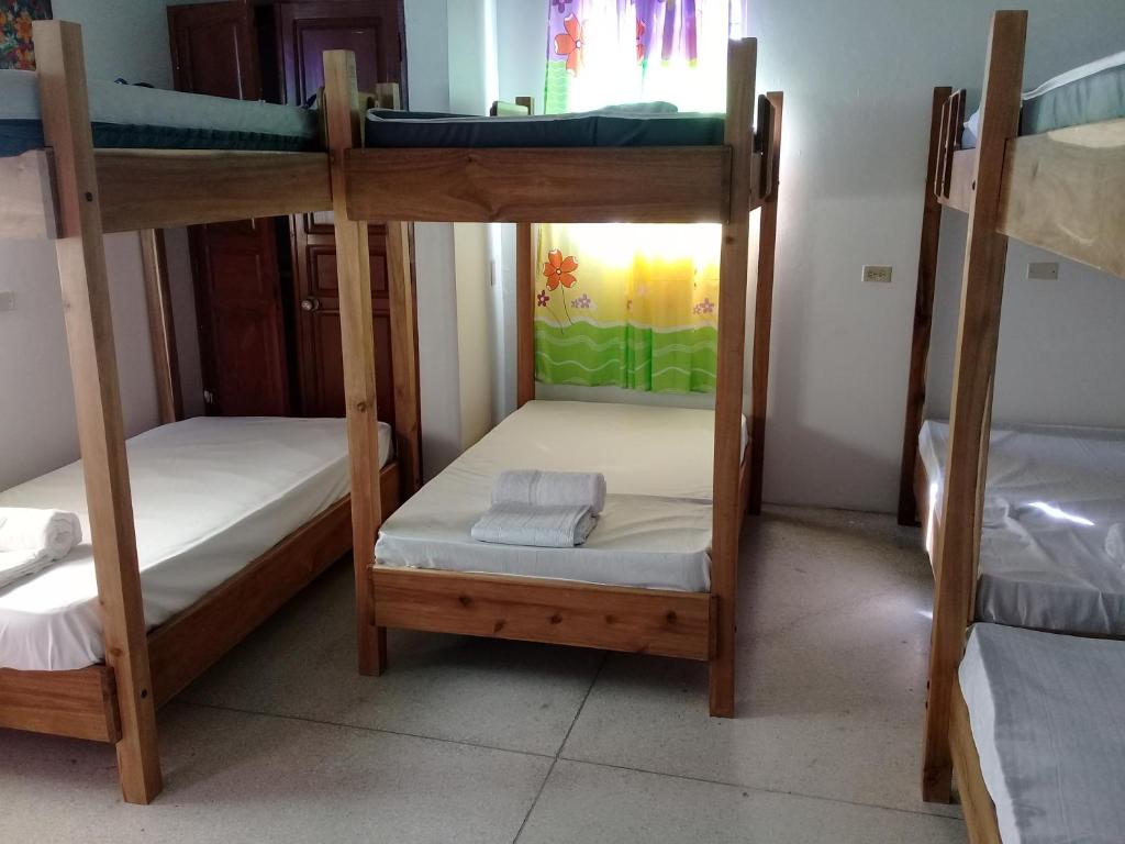 Postel nebo postele na pokoji v ubytování Hostel Quintonido