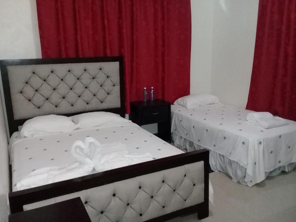 Postel nebo postele na pokoji v ubytování Hostel Quintonido