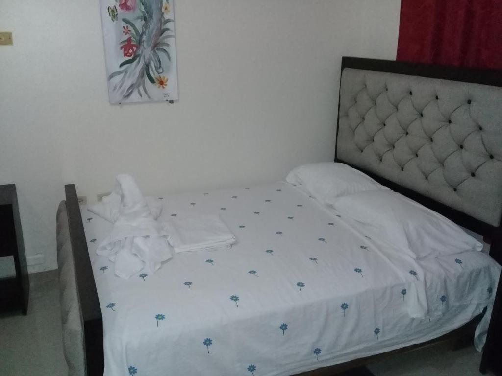 Postel nebo postele na pokoji v ubytování Hostel Quintonido