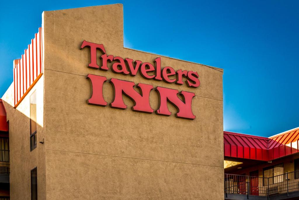 a travelodge inn sign on the side of a building at Travelers Inn - Phoenix in Phoenix