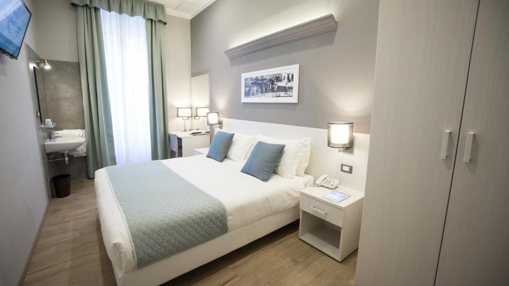 Posteľ alebo postele v izbe v ubytovaní Nuovo Albergo Centro