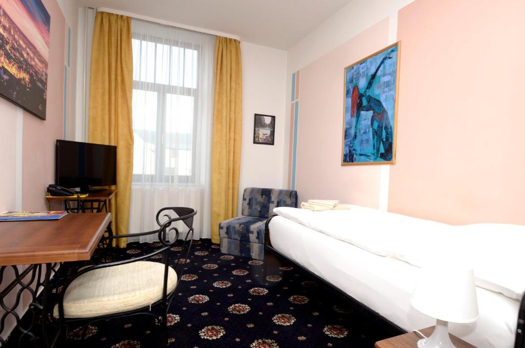 Postel nebo postele na pokoji v ubytování Brioni Boutique Hotel 4*