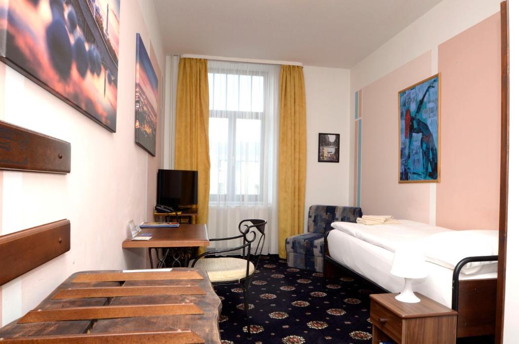 Postel nebo postele na pokoji v ubytování Brioni Boutique Hotel 4*