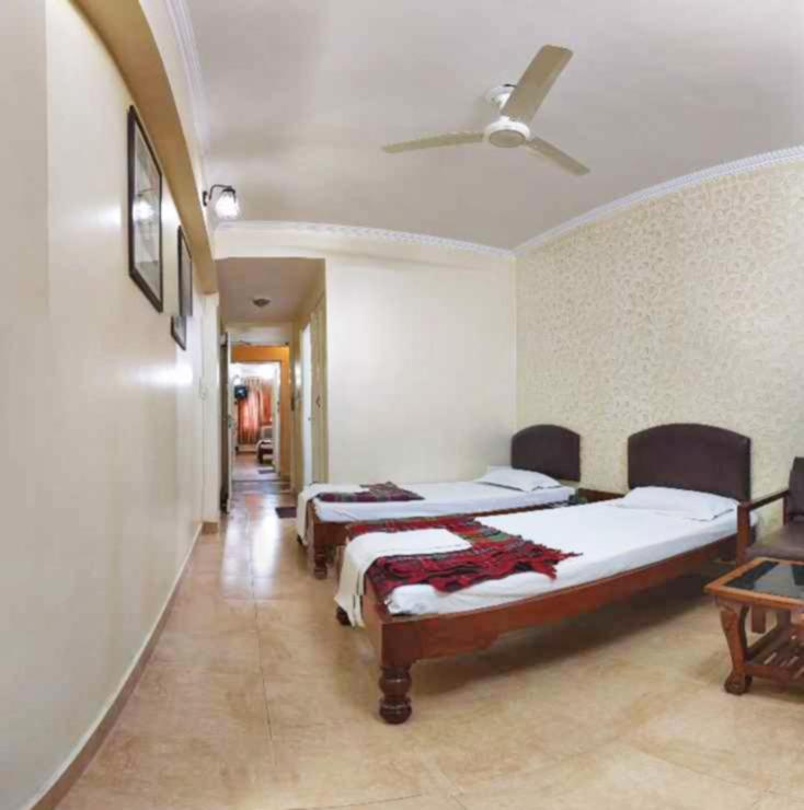 Postel nebo postele na pokoji v ubytování Hotel Rangoli