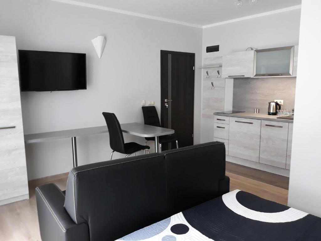 Kuchyňa alebo kuchynka v ubytovaní Apartamenty Pod Skrzycznem