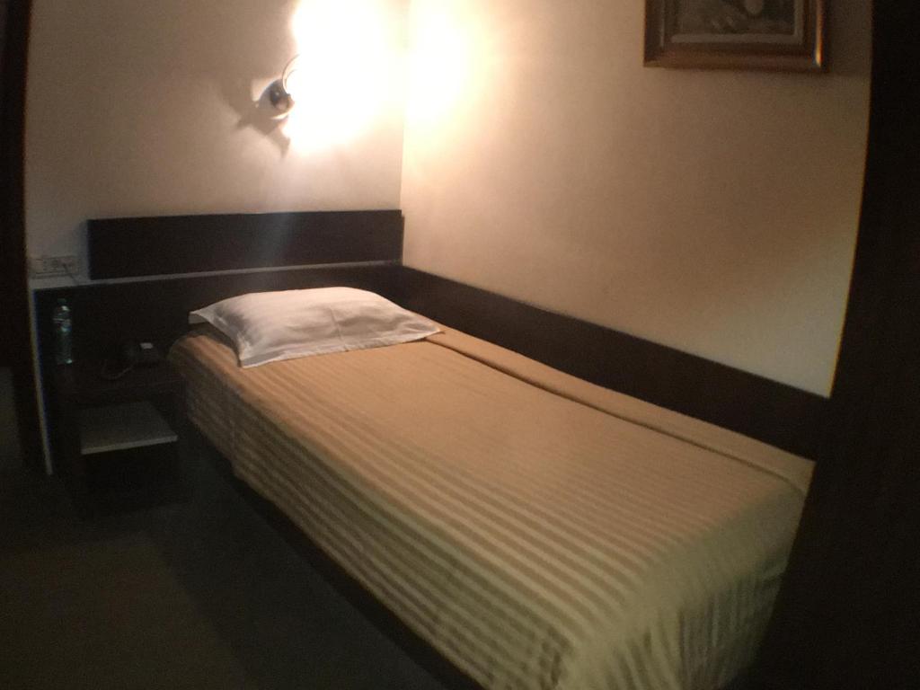 Postel nebo postele na pokoji v ubytování Hotel Kilometrul Zero