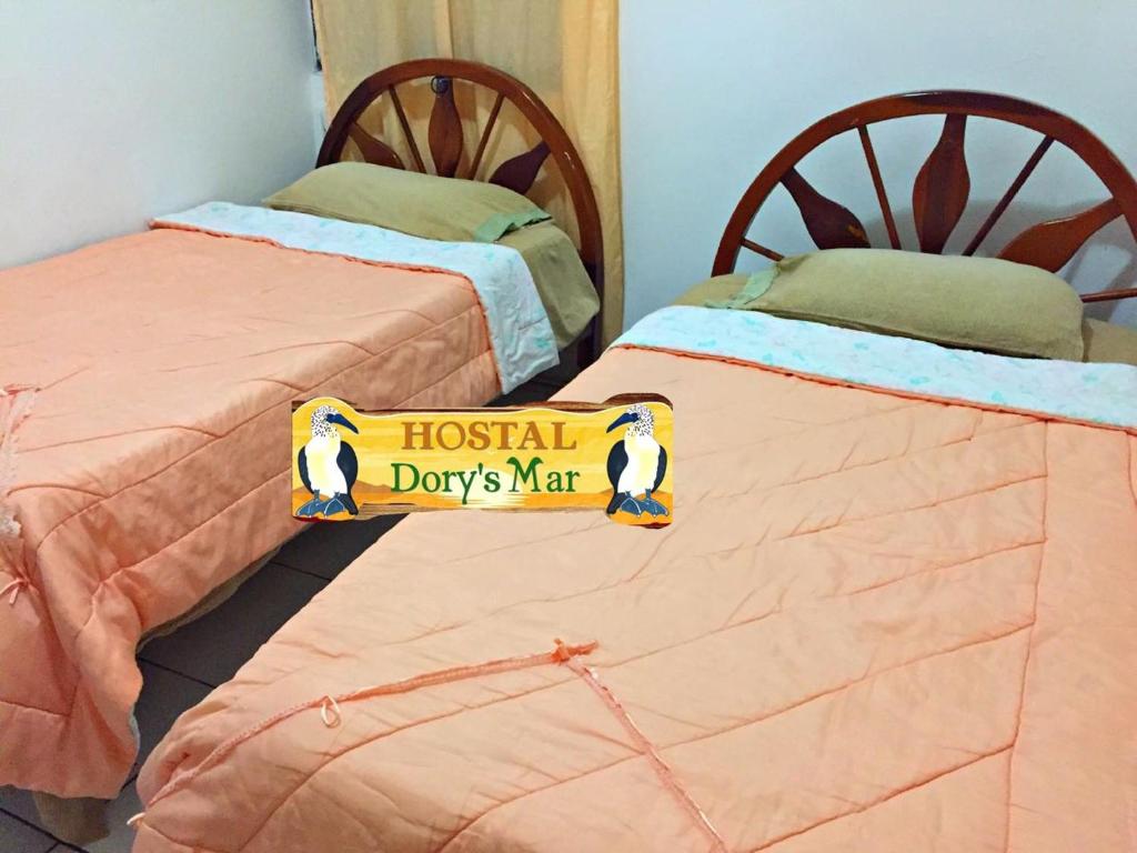Postel nebo postele na pokoji v ubytování Hostal Dorys Mar