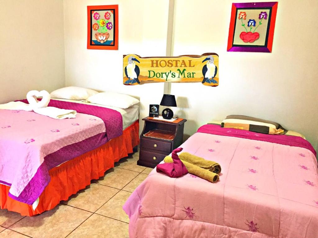 Postel nebo postele na pokoji v ubytování Hostal Dorys Mar
