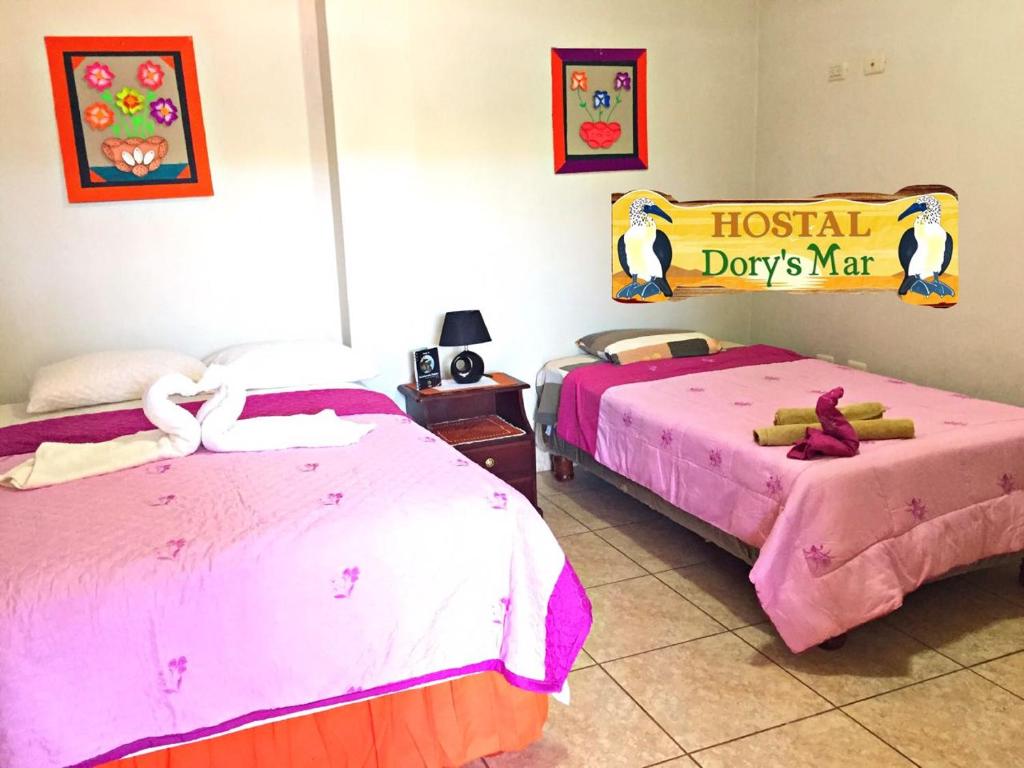 Postel nebo postele na pokoji v ubytování Hostal Dorys Mar