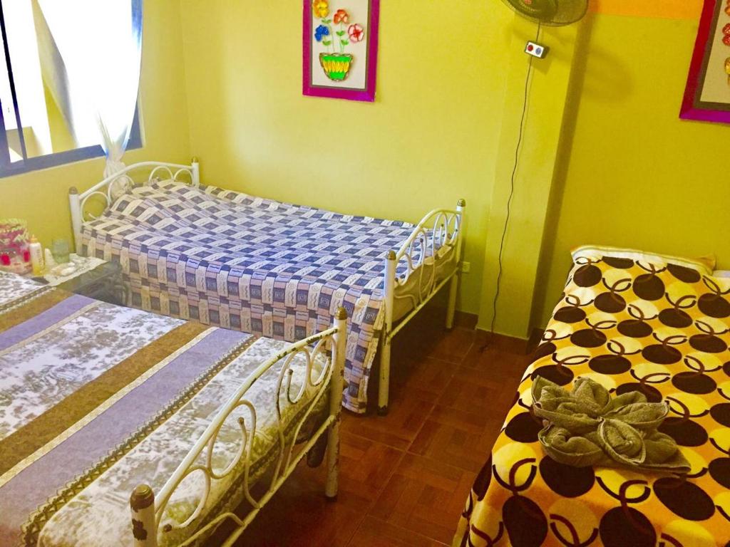 Postel nebo postele na pokoji v ubytování Hostal Dorys Mar