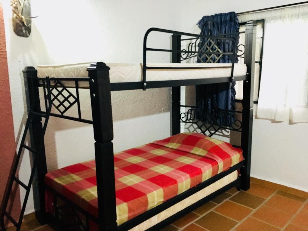 Llit o llits en una habitació de Cabañas La Carolina - Mesa de Los Santos
