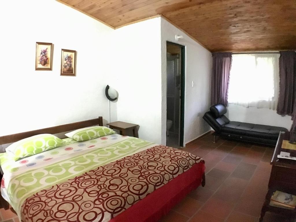 Llit o llits en una habitació de Cabañas La Carolina - Mesa de Los Santos