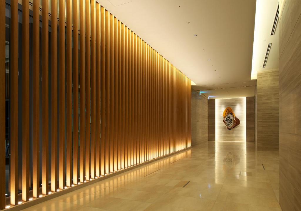 a hallway of a building with a wall of wood panels at Nagoya JR Gate Tower Hotel in Nagoya
