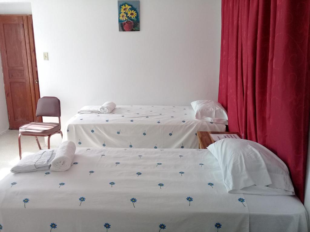 Postel nebo postele na pokoji v ubytování Hostel Quintonido