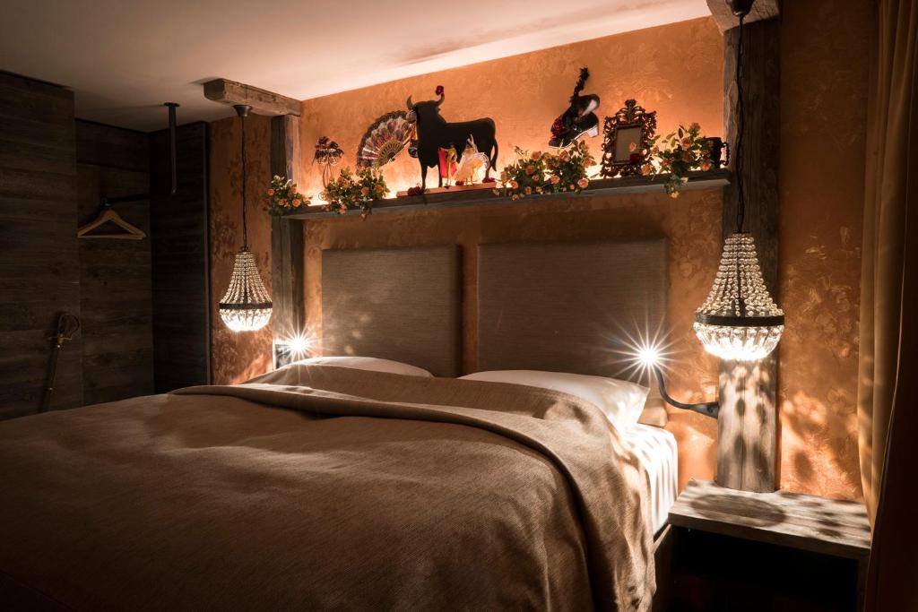Postel nebo postele na pokoji v ubytování Boutique Hotel im Auracher Löchl