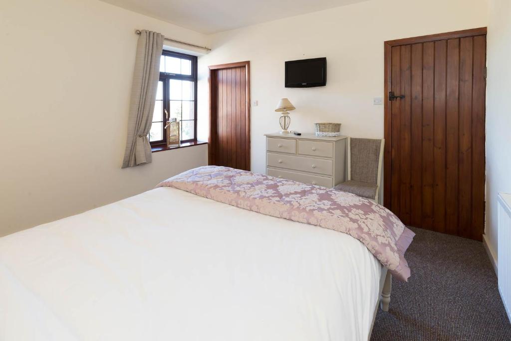 Postel nebo postele na pokoji v ubytování Hotel Rudyard