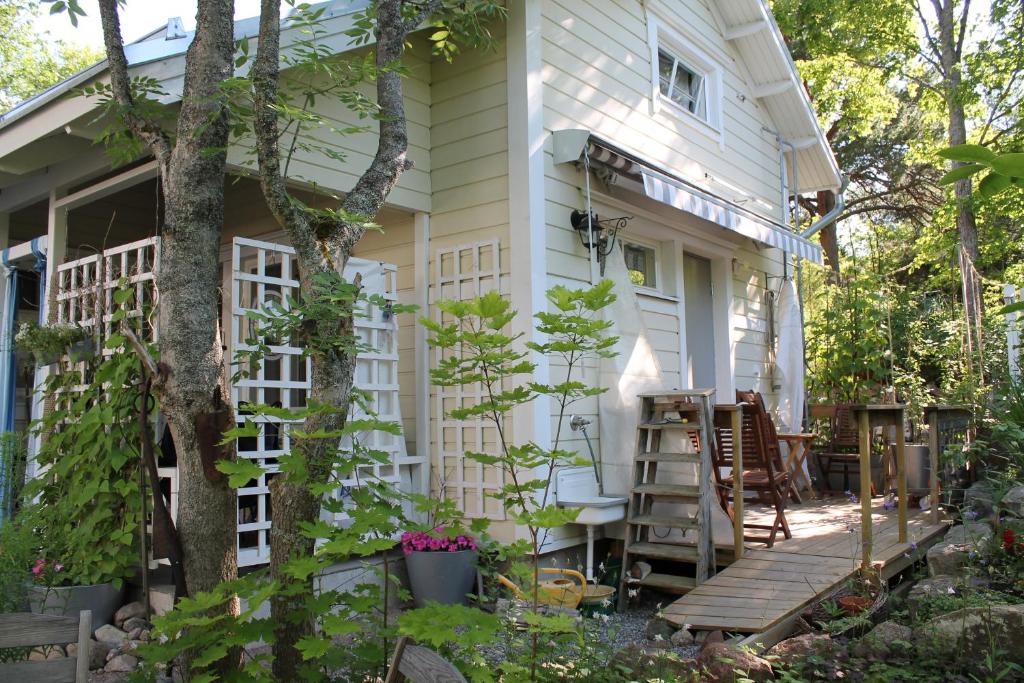 a house with a porch and a deck at Oak House in Naantali