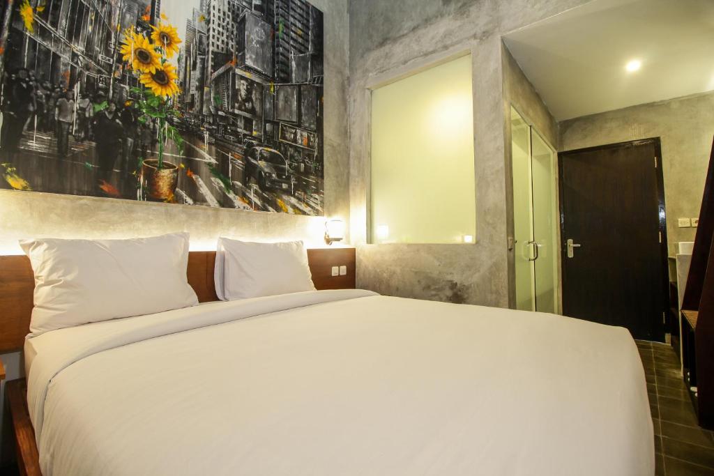 Postel nebo postele na pokoji v ubytování Watu Agung Guest House