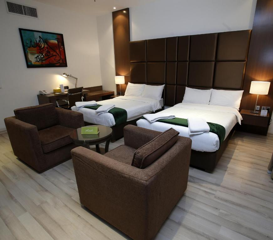 Katil atau katil-katil dalam bilik di Rawda Hotel