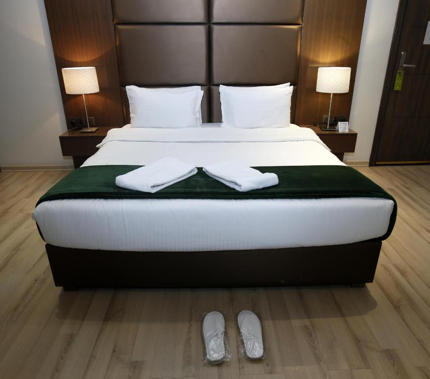 Katil atau katil-katil dalam bilik di Rawda Hotel