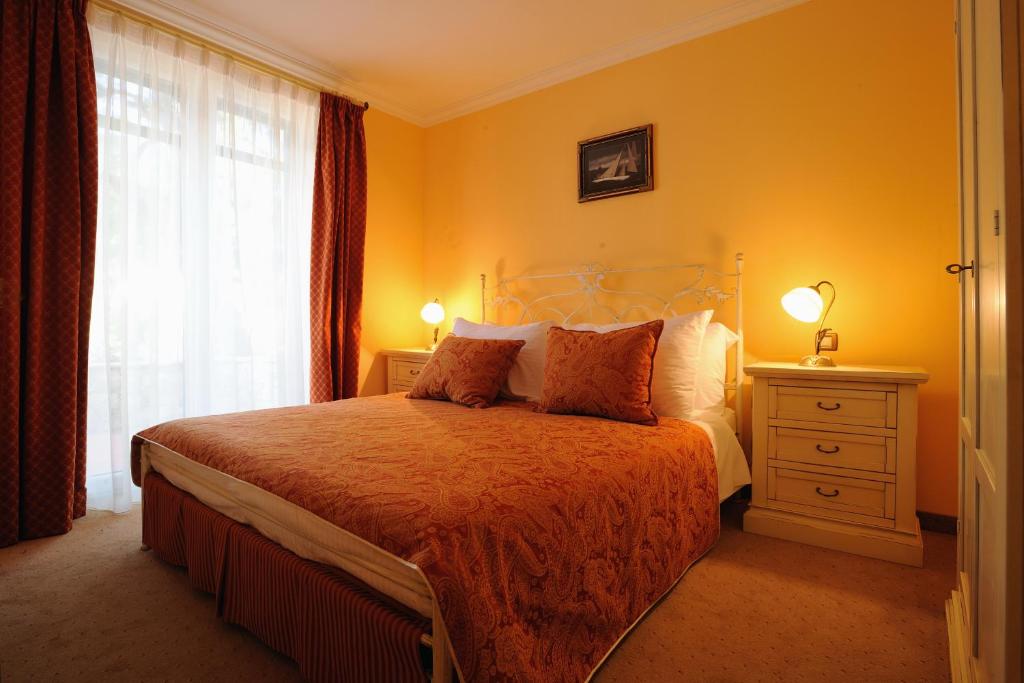 Postel nebo postele na pokoji v ubytování Hotel Solitudo