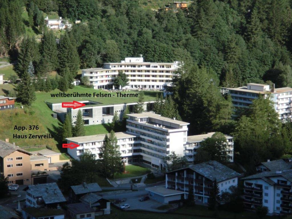 a city with a red arrow pointing to a building at Haus Zervreila in Vals