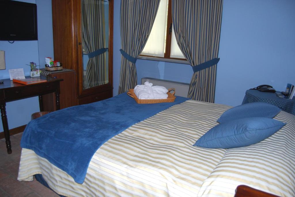 Posteľ alebo postele v izbe v ubytovaní Hotel Locanda Da Carla