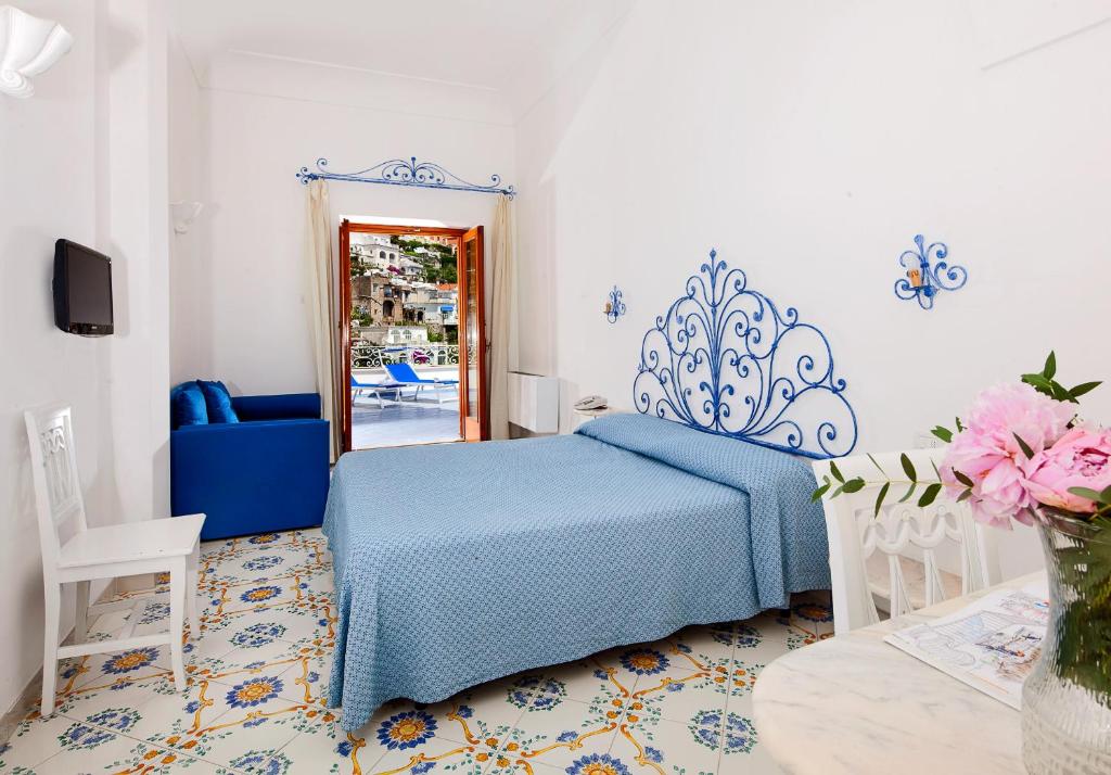 Postel nebo postele na pokoji v ubytování Hotel Vittoria