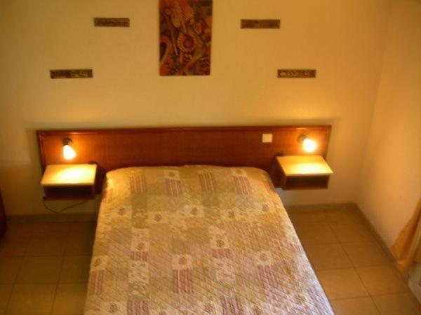 Postel nebo postele na pokoji v ubytování Hôtel de la Madeleine Anduze