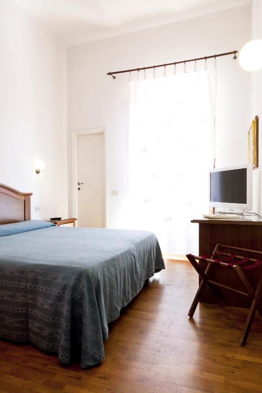 Postel nebo postele na pokoji v ubytování Hotel Savoia e Campana