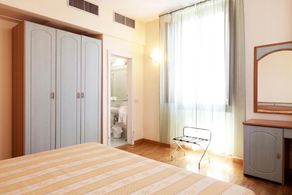 Postel nebo postele na pokoji v ubytování Hotel Savoia e Campana