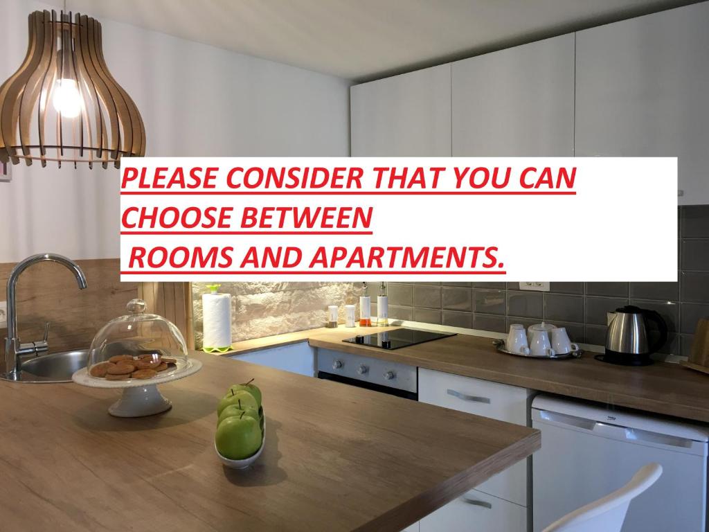 a kitchen with a counter top with a sink and a counter top at Central Split rooms and apartments Paese in Split