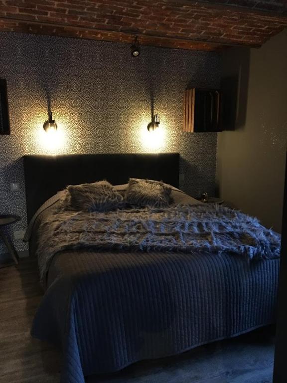 Postel nebo postele na pokoji v ubytování Gîte de Corbion loft2