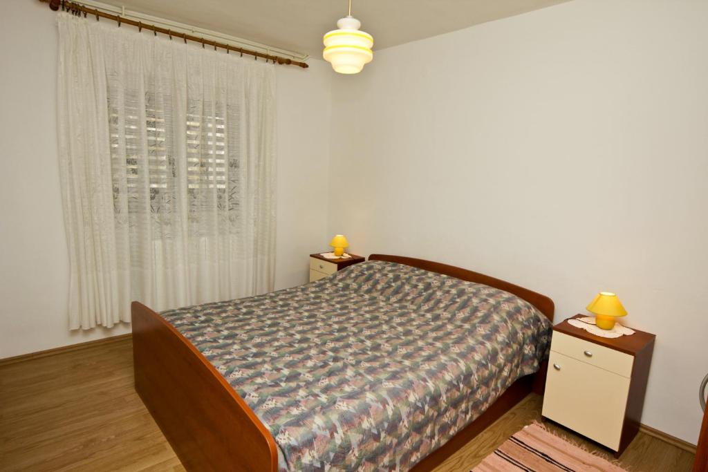 Posteľ alebo postele v izbe v ubytovaní Apartments Ivanko