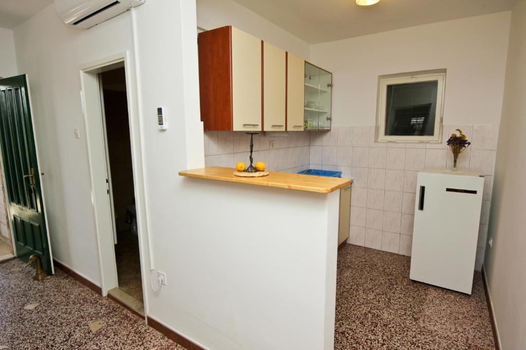 Kuchyňa alebo kuchynka v ubytovaní Apartments Ivanko