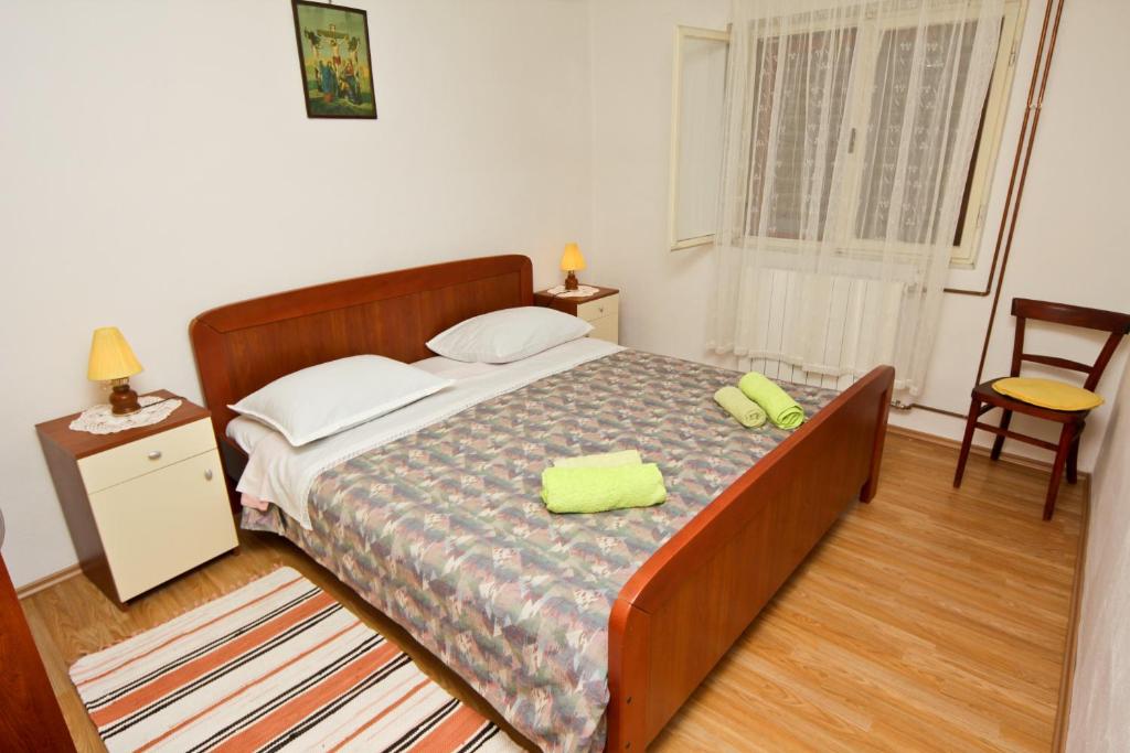 Posteľ alebo postele v izbe v ubytovaní Apartments Ivanko