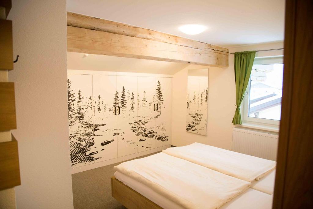 Postel nebo postele na pokoji v ubytování Haus Filzmoos
