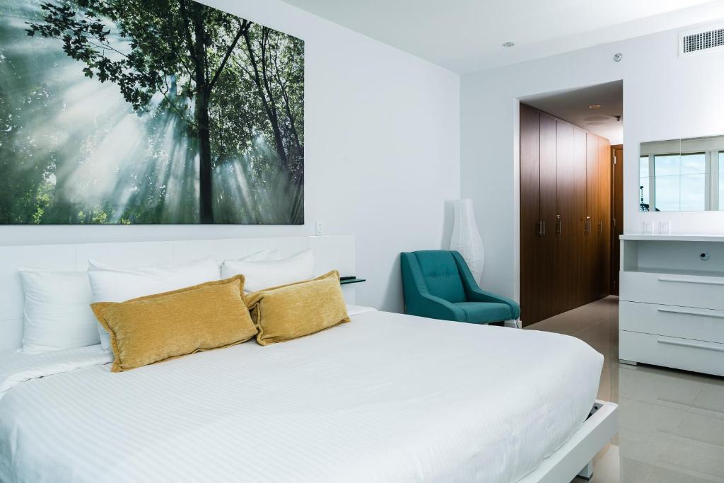 Postel nebo postele na pokoji v ubytování Blue Residences