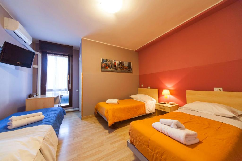 Postel nebo postele na pokoji v ubytování Hotel Albi